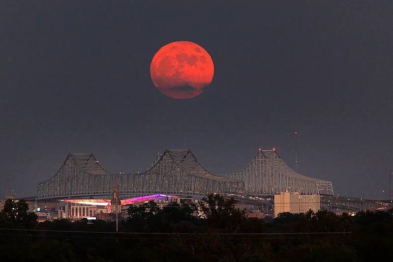 A super blue moon rises above the Mississippi River and Crescent City Connection Bridge in New Orleans, on August 30, 2023